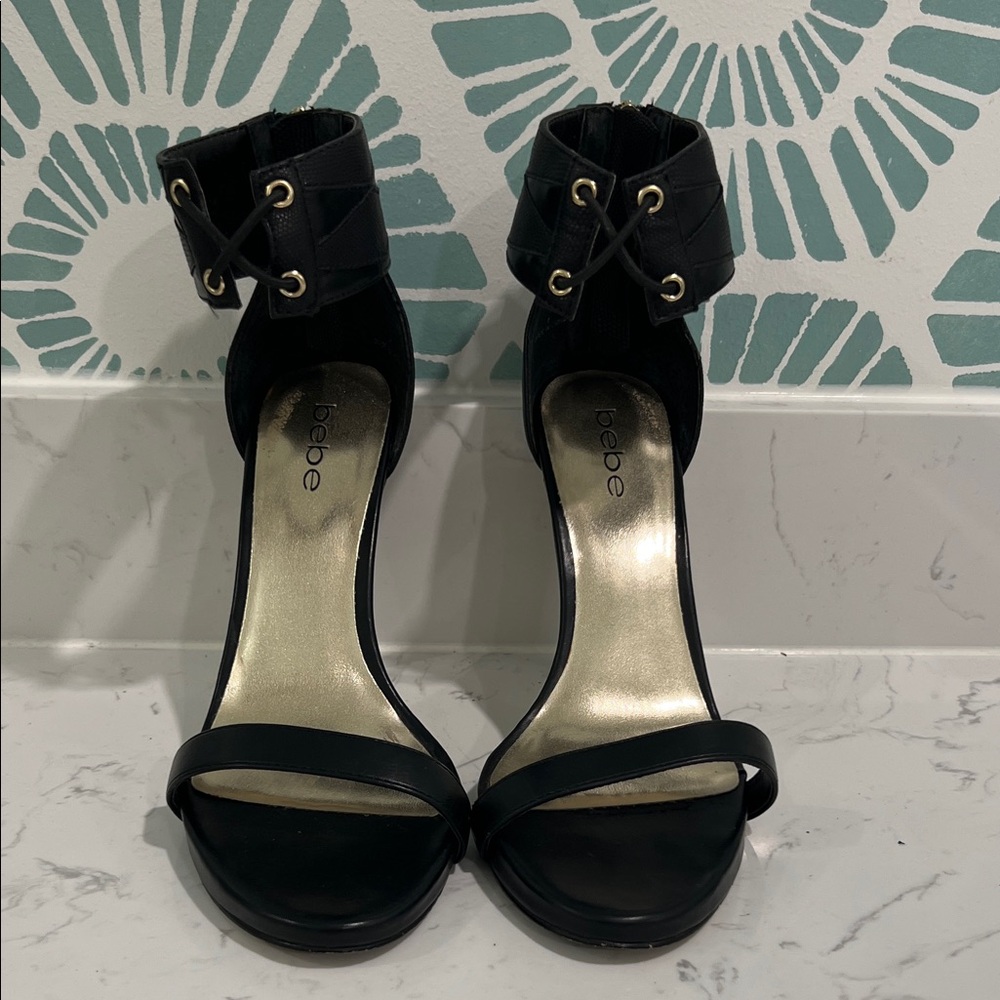bebe Black Open-Toe Ankle-Strap Heels with Gold Accent